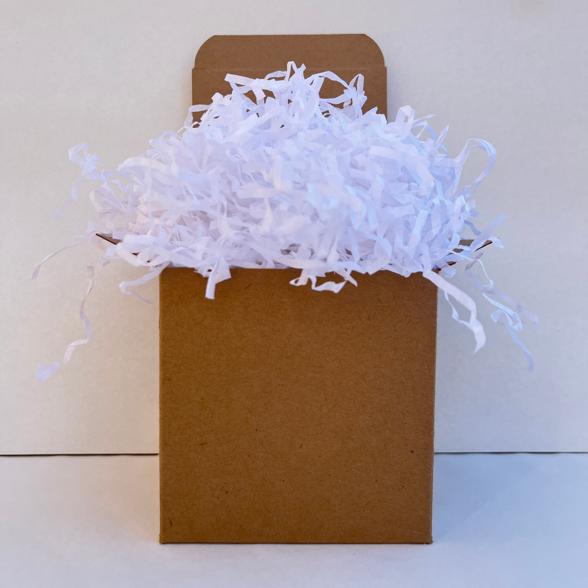 White shredded paper in gift box packaging eco friendly filler