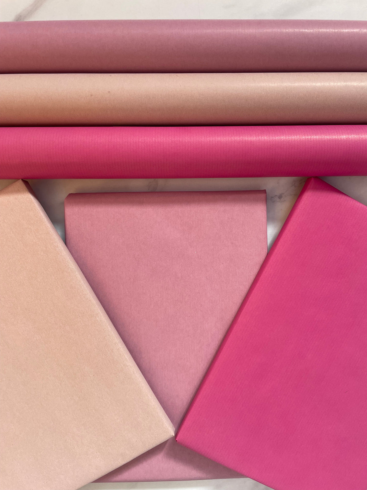 Pale Pink, Pink and Strong Pink kraft wrapping paper colour palette
