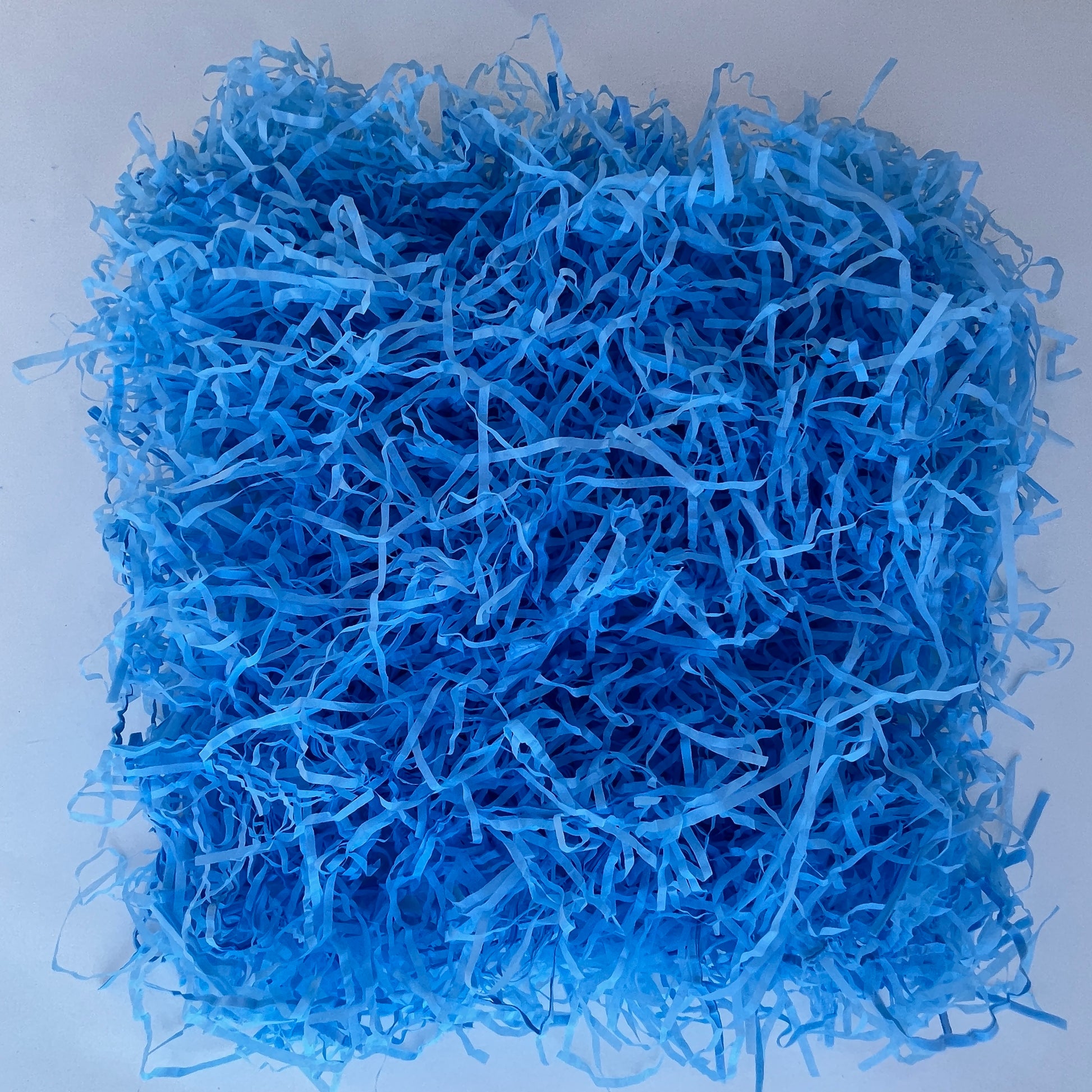 Blue shredded paper filler 25g eco friendly recycled packaging fill