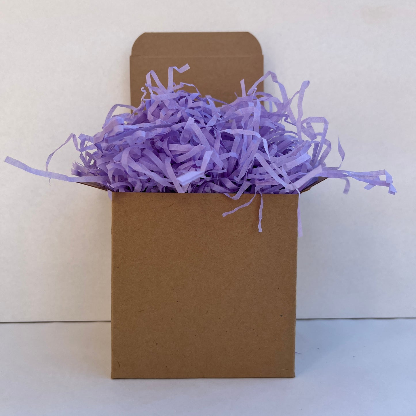 Lilac shredded paper in gift box packaging eco friendly filler